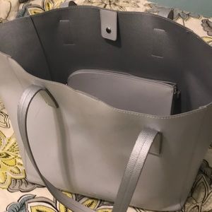 Light gray tote bag with tiny clutch purse